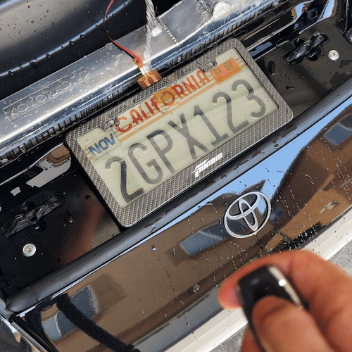 Black Out License Plate Water Pouring, Switching On Off With Water, Fully Weather Proof Black Out Plate Cover Front Shot On Toyota Supra California License Plate