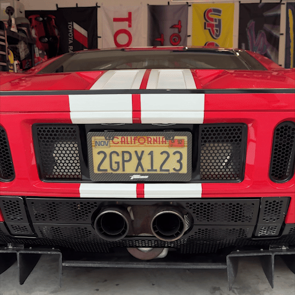 Blackout license plate cover on red 2006 ford GT, Day Time Blackout License Plate Gif, Garage Shot of Ford GT California Carbon Fiber License Plate Frame