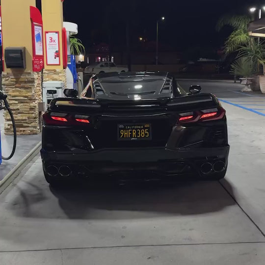 Fantom blackout license plate switching to black on a Corvette C8 at night